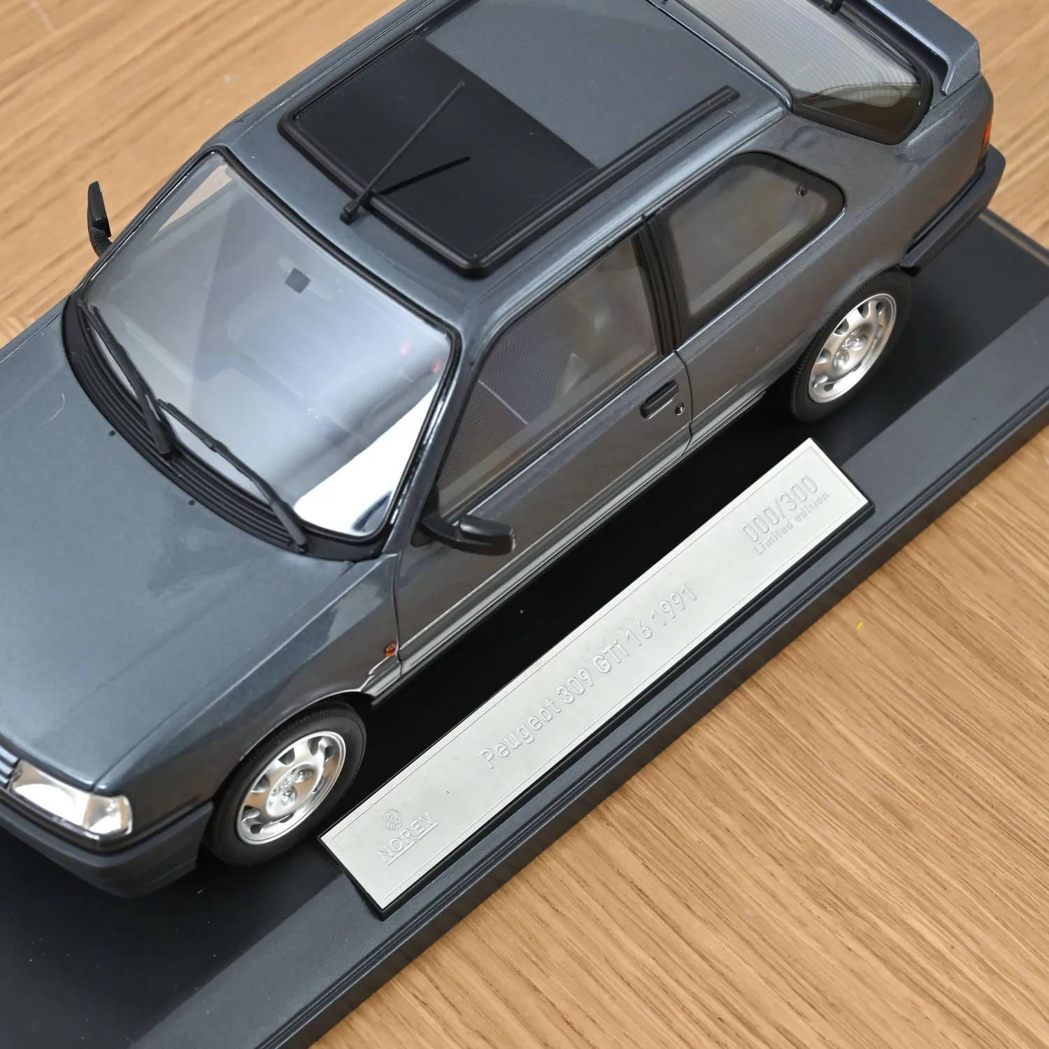 Norev Peugeot 309 GTi 16 1991 miniature 1/18 gris magnum 300 ex
